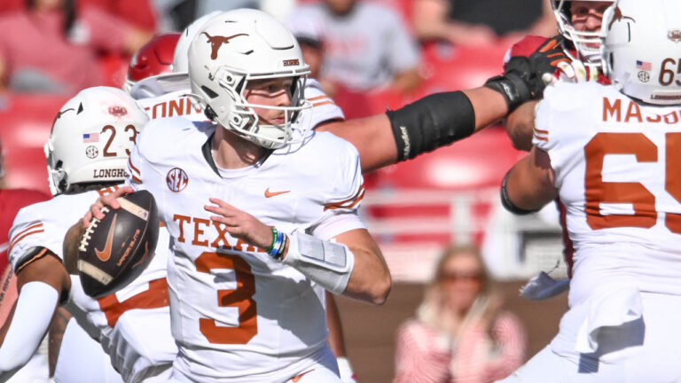 Texas Longhorns quarterback Quinn Ewers drops back to pass against the Arkansas Razorbacks