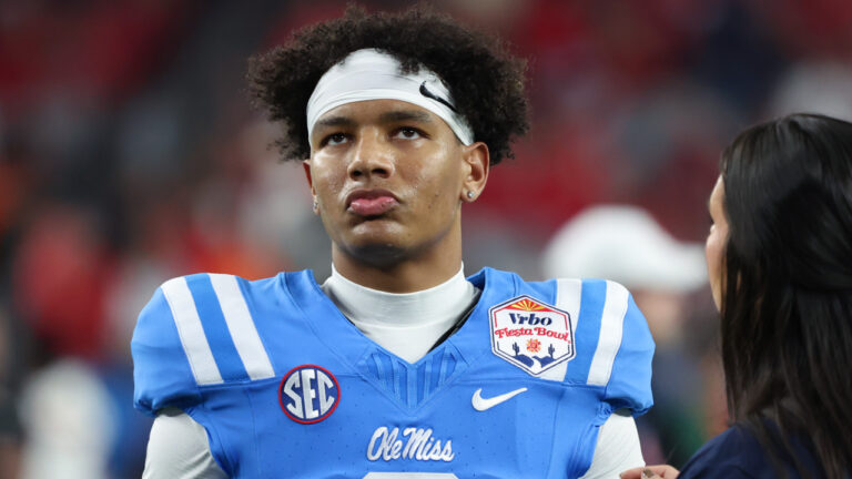 Ole Miss quarterback Trinidad Chambliss walks off the field after a Fiesta Bowl loss to the Miami Hurricanes