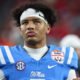 Ole Miss quarterback Trinidad Chambliss walks off the field after a Fiesta Bowl loss to the Miami Hurricanes